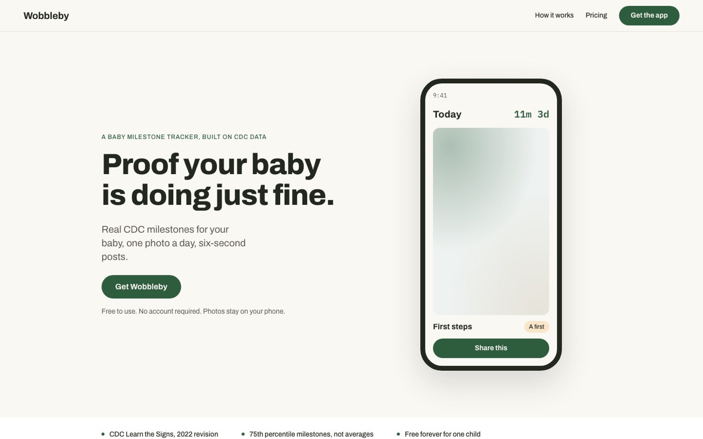 The original dark green marketing site, with a phone mockup whose screen is an empty grey-green gradient